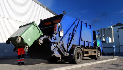 Waste collection trucks operating in South East London streets